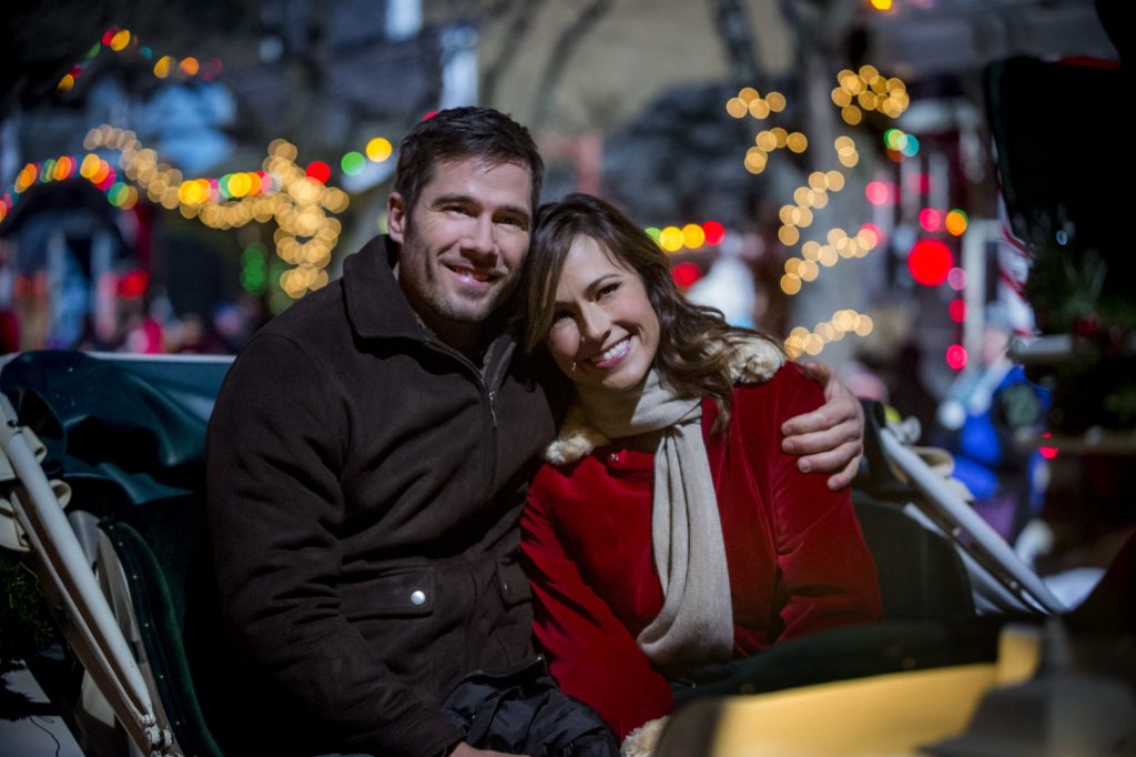 A successful New York businesswoman learns her beloved late Grandmother has left her 'Christmas Land', a magical Christmas themed village in the country side. Photo: Luke Macfarlane, Nikki Deloach Credit: Copyright 2015 Crown Media United States, LLC/Photographer: Fred Hayes