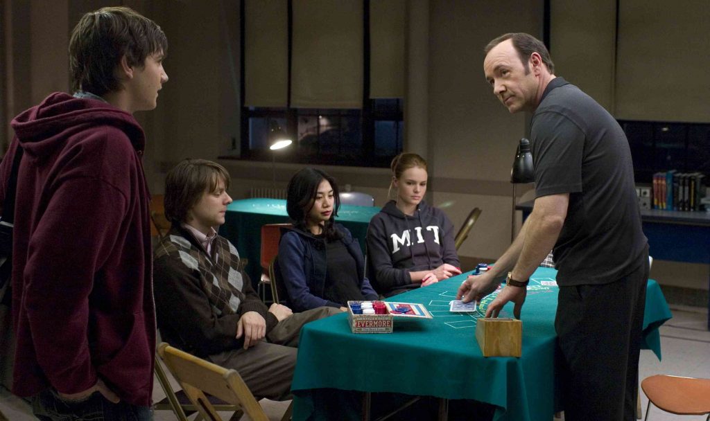 In Columbia PicturesÕ 21, the M.I.T. blackjack team Ð a group of students that has figured out how to take Vegas for millions Ð practices counting cards.  Left to right: Ben Campbell (Jim Sturgess), Fisher (Jacob Pitts), Kianna (Liza Lapira), Jill Taylor (Kate Bosworth), Micky Rosa (Kevin Spacey).  Directed by Robert Luketic, the screenplay is by Peter Steinfeld and Allan Loeb, based upon the book "Bringing Down the House" by Ben Mezrich.  The producers are Dana Brunetti, Kevin Spacey, and Michael De Luca.  The film opens in theaters nationwide on March 28, 2008.